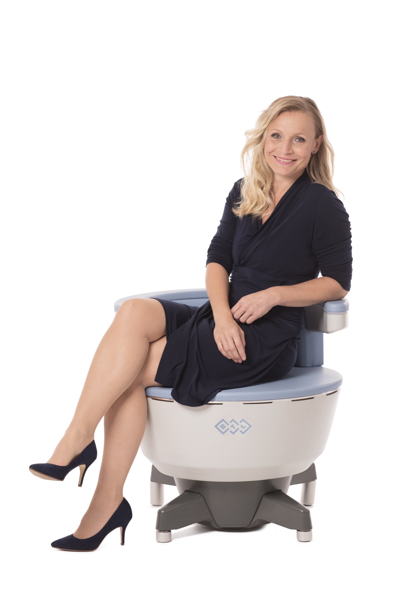 Woman seated on BTL Emsella chair, Emsella nocturia pelvic floor treatment at Princeton Aesthetics